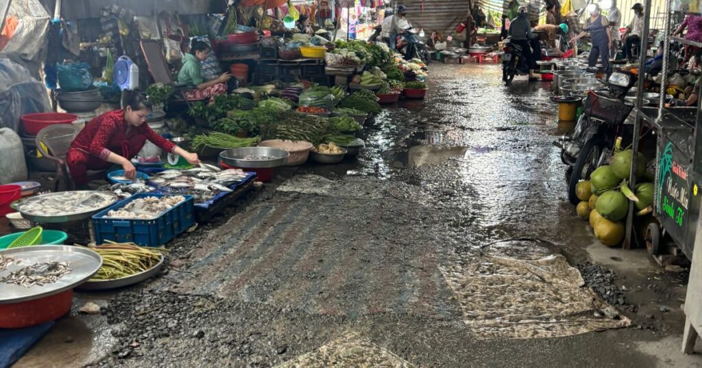 Cai Be village market during rainy season in hcmc