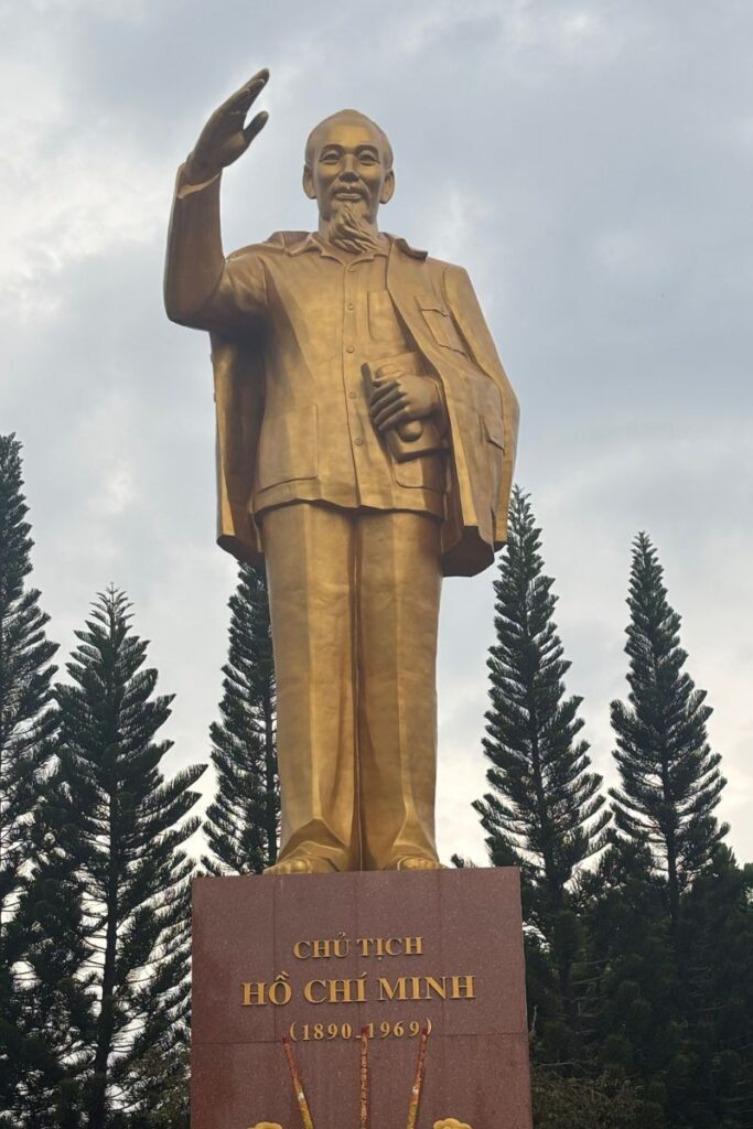 The Ho Chi Minh Monument on the Can Tho waterfront is one of the most iconic Can Tho attractions, set against a cloudy sky.