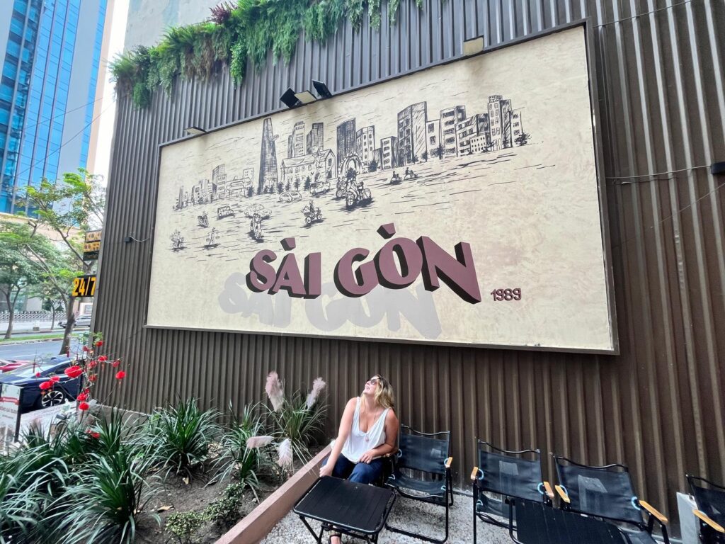 Megan under the Saigon sign. 