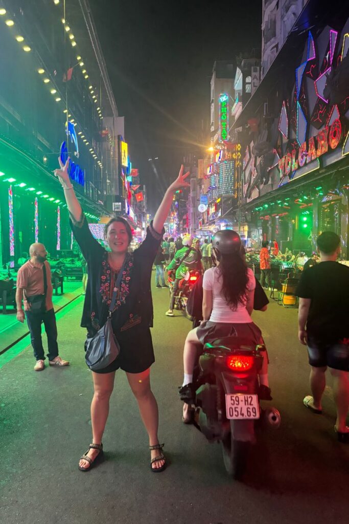 Celebrating on the lively Bui Vien Street in Ho Chi Minh City, an area where visitors should stay alert for Vietnam scams.