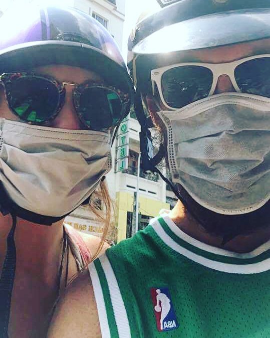 Megan and Garrett wearing protective masks in Saigon, Vietnam 