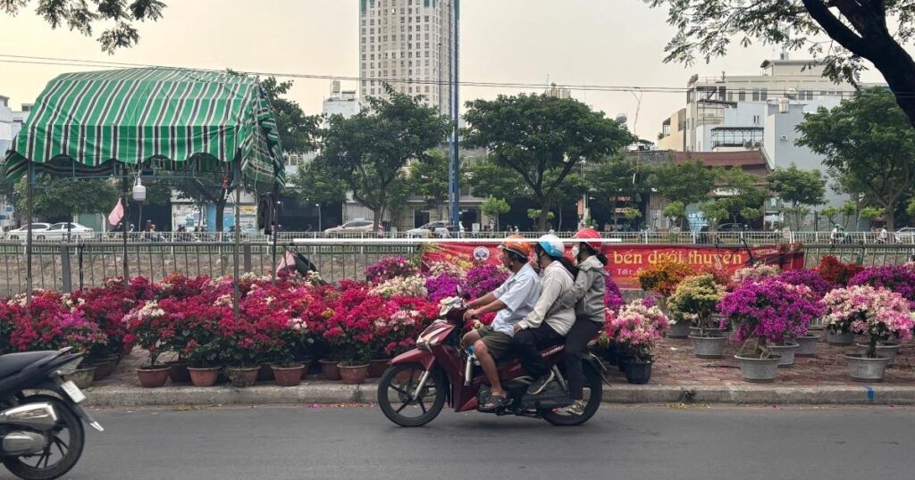 Motorbikes and canal in Saigon Vietnam