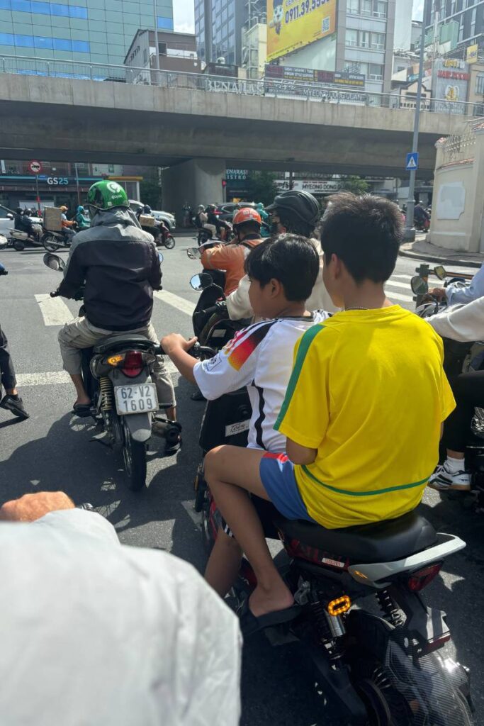 Young men driving in Ho Chi Minh City