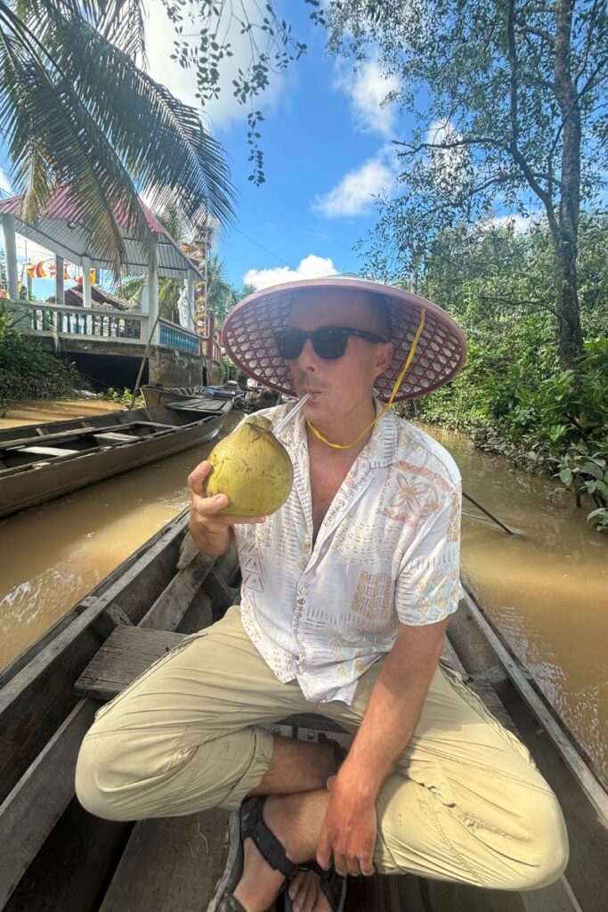 Drinking a coconut on the Mekong River