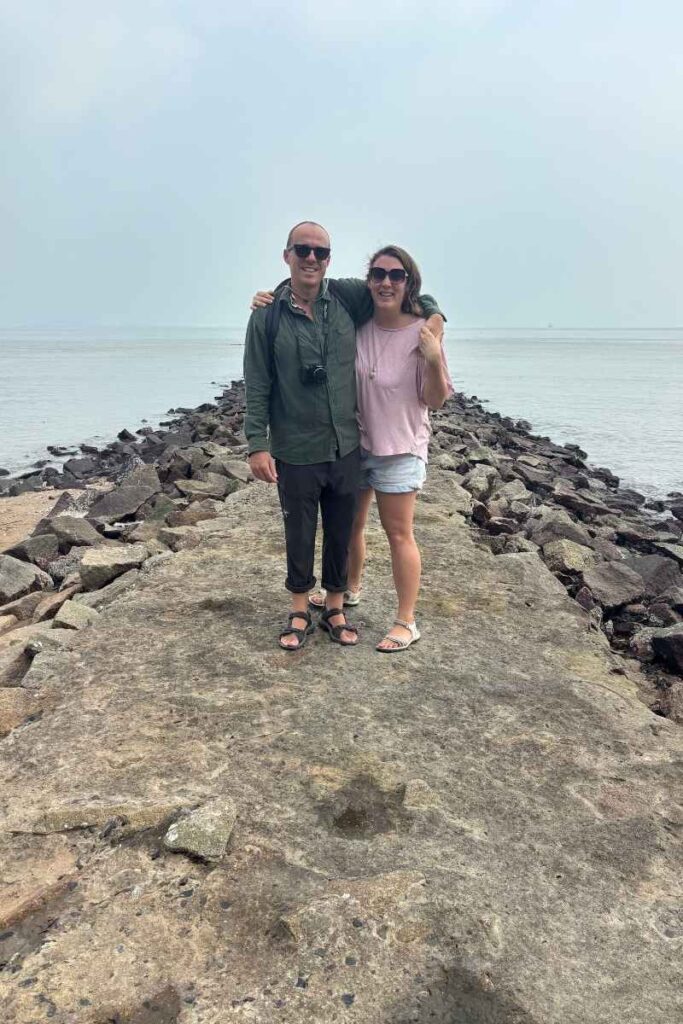 Standing on a jetty off the boardwalk for a photo