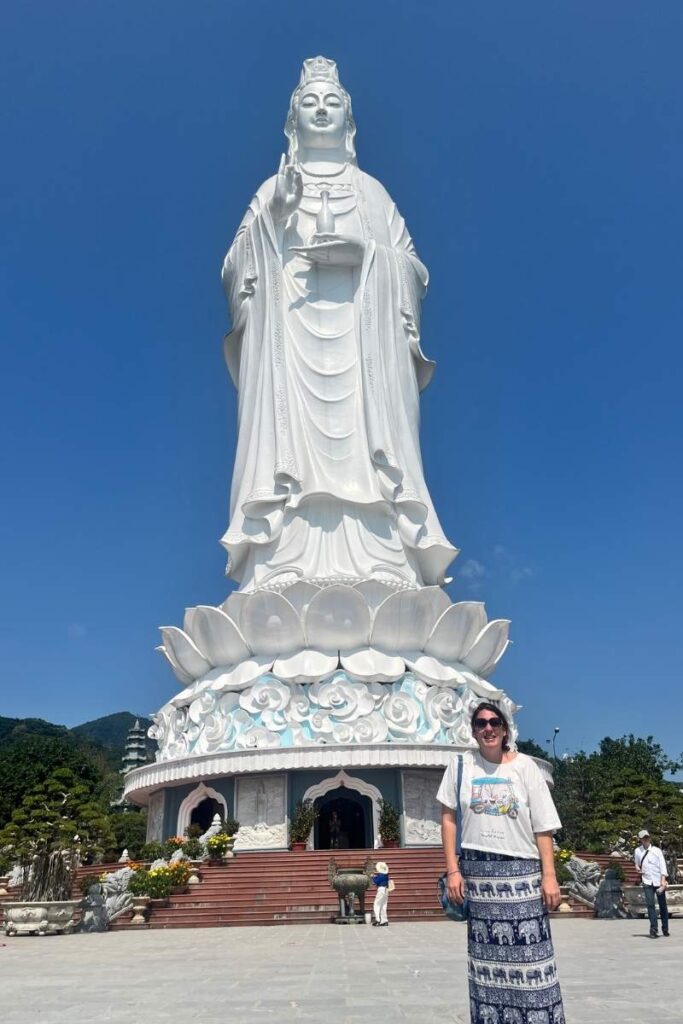 Standing in front of the towering Lady Buddha statue at Linh Ung Pagoda in Da Nang, one of the most spiritual and scenic places to visit in Da Nang.