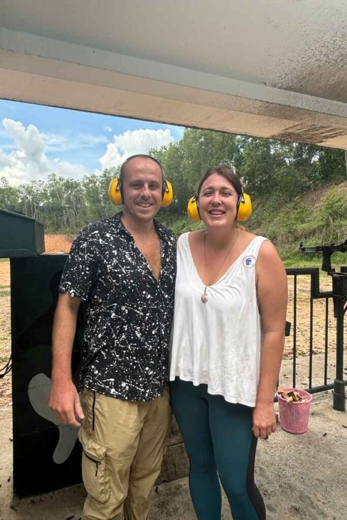 Garrett and Megan wearing ear protection at the firing range at Cu Chi Tunnels