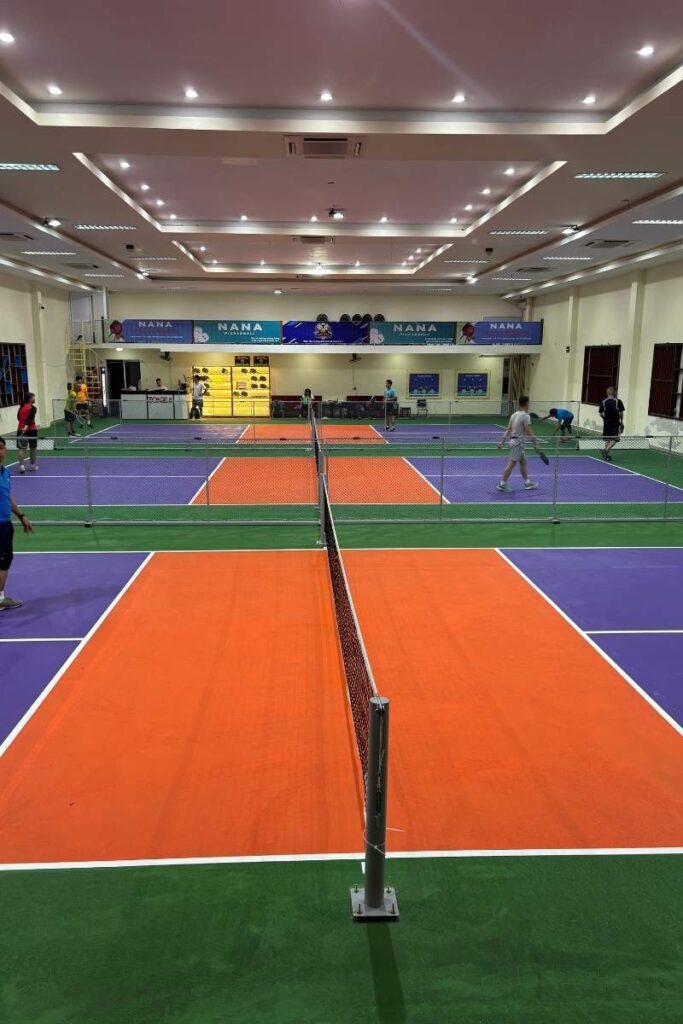 Colorful indoor pickleball courts in Da Nang, offering a fun and social activity for visitors looking to stay active while exploring Da Nang city activities.