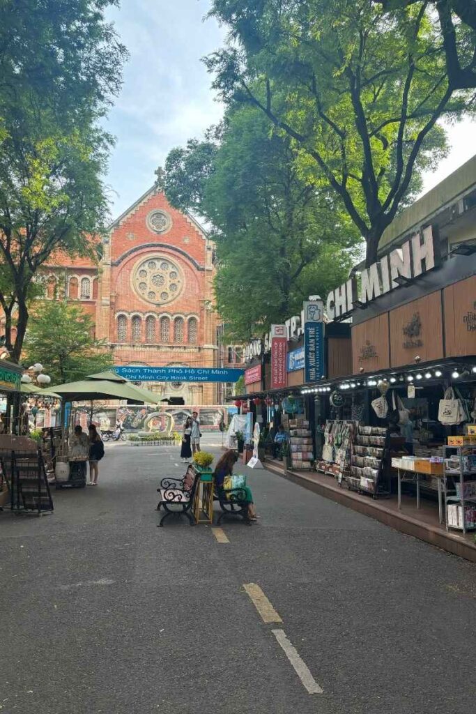 Pedestrian-only Book Street in Ho Chi Minh City lined with bookshops, outdoor seating, and shaded by trees, a peaceful spot among Ho Chi Minh City attractions.