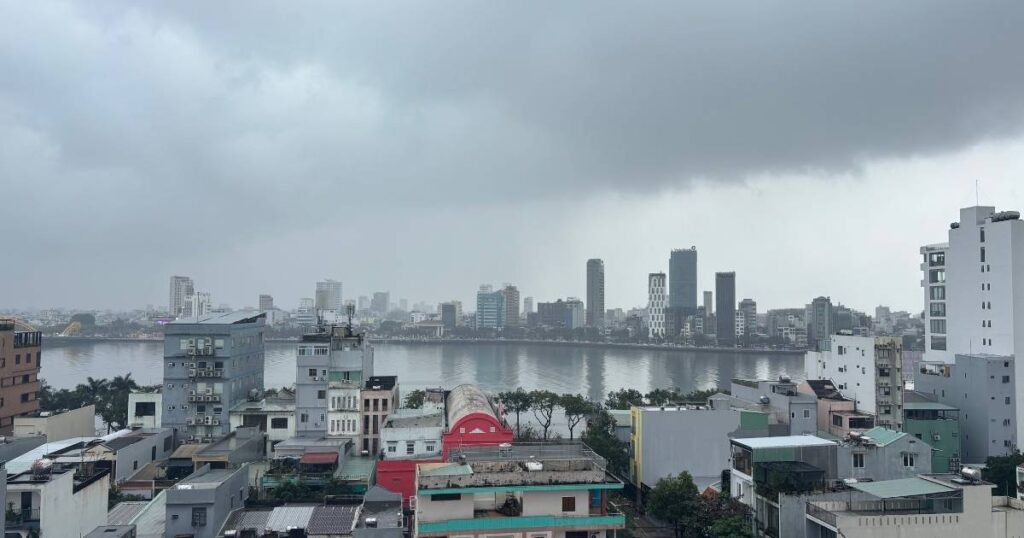 Cloudy rooftop view overlooking the Han River and Da Nang city skyline, showcasing the urban side of Da Nang and a great perspective for spotting city highlights.