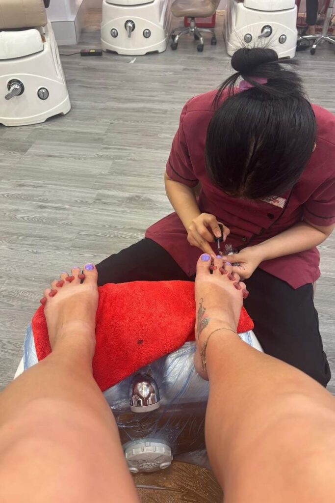 Getting a pedicure and a massage at a spa in Ho Chi Minh City, a relaxing experience among top HCMC attractions.