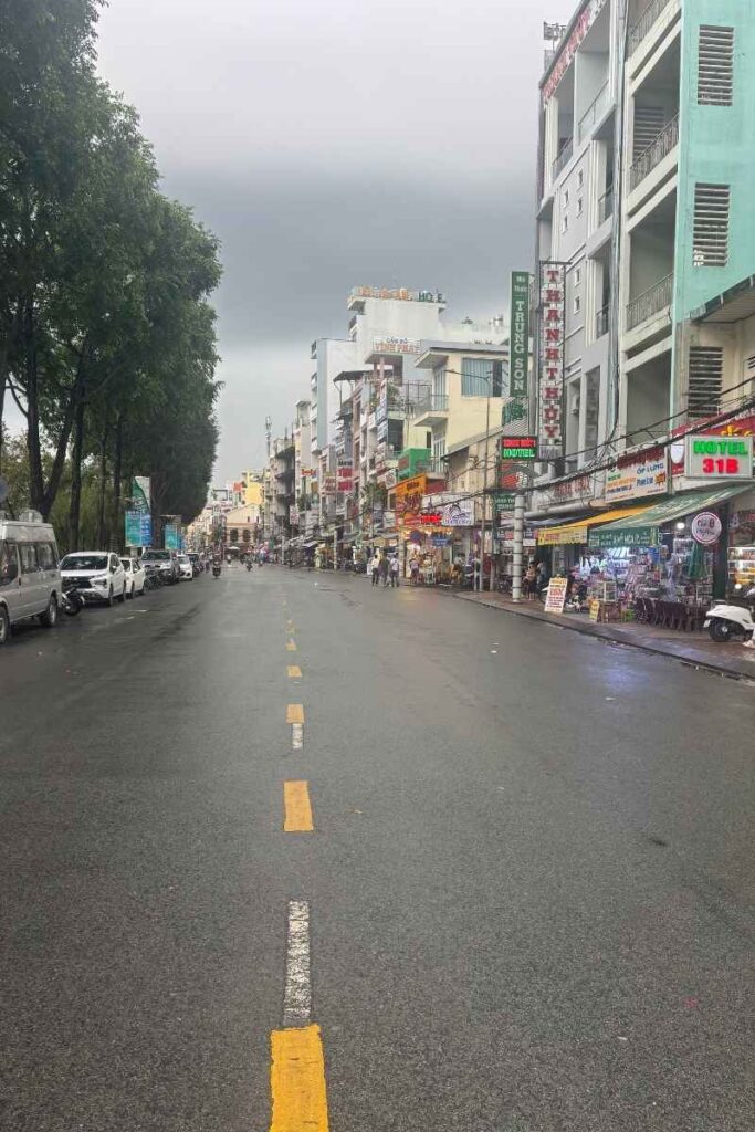 A quiet street in Ho Chi Minh City, Vietnam, captured early in the morning before the city’s usual bustle and potential scams in Vietnam begin.