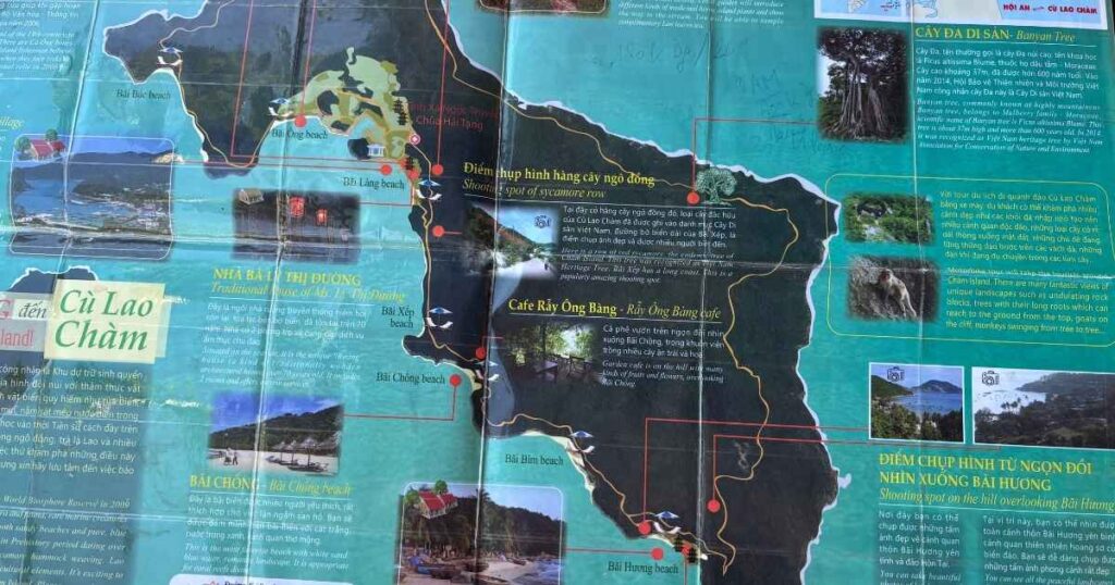 Worn and folded map of Cu Lao Cham island showing beaches, viewpoints, and local landmarks in Vietnamese, with photos and text scattered across a turquoise background.